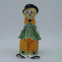 a doll wearing a hat and a hat 